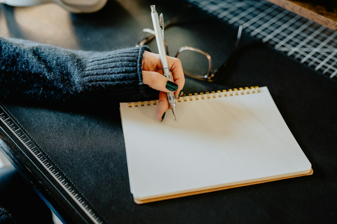 journal writing at desk