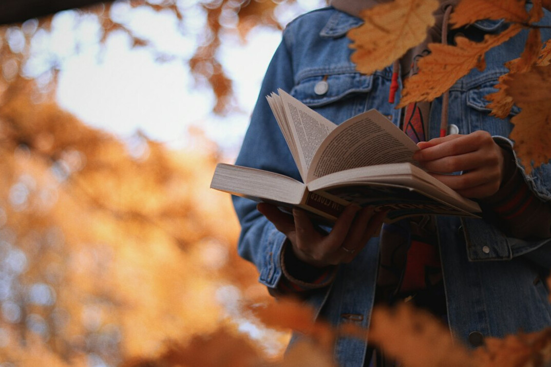 person reading self help book
